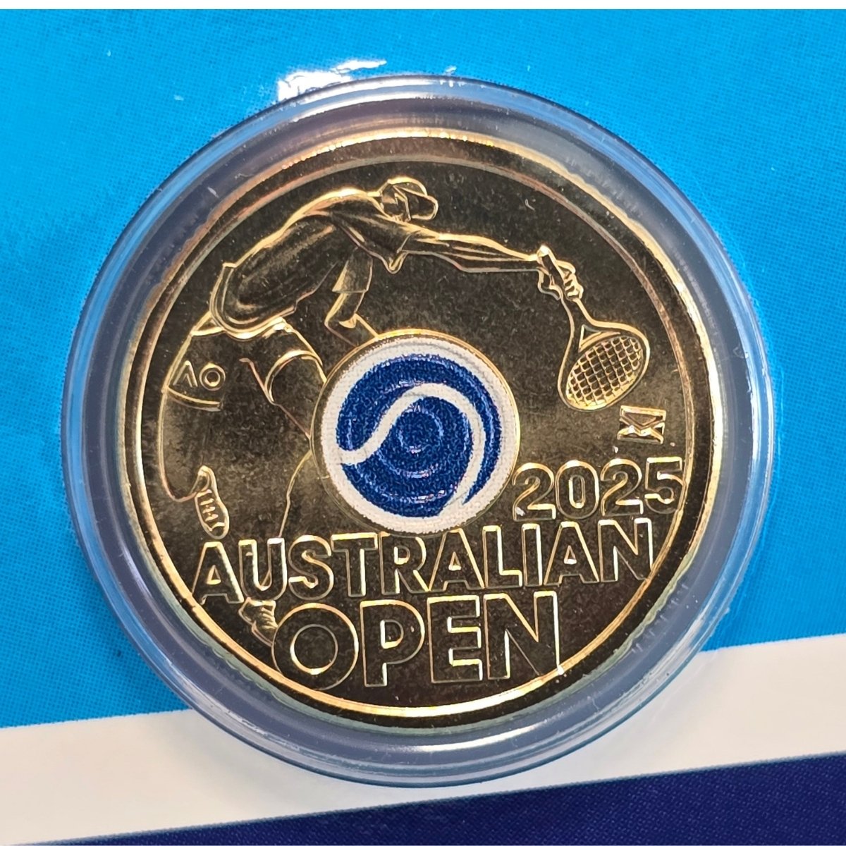 2025 $2 Australian Open Men's coin with blue tennis ball colour in centre and envelope privy mark - reverse