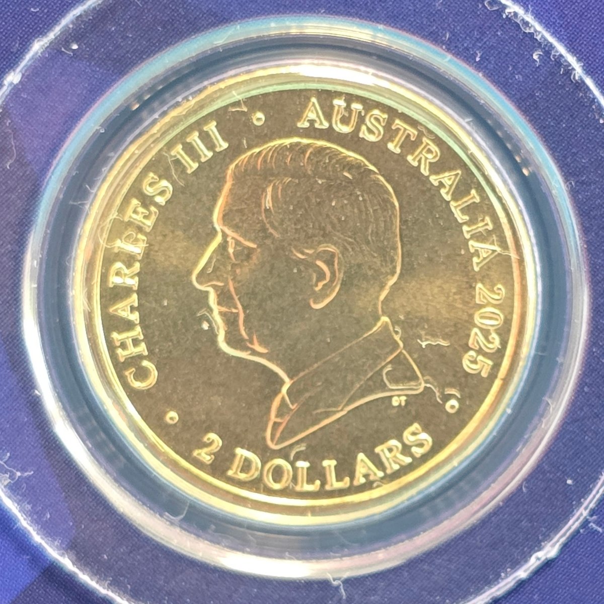 2025 $2 Australian Open Men's Privy Mark Coin obverse featuring King Charles III effigy and DT initials