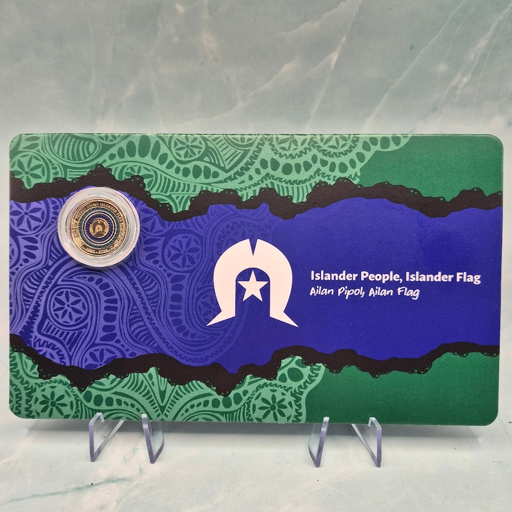 Front of 2025 $2 Torres Strait Islander Flag 'C' Mintmark carded coin