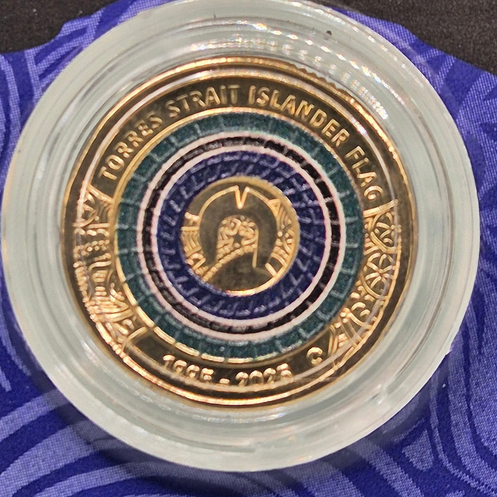 Close up reverse side of 2025 $2 'C' Mintmark Anniversary of the Torres Strait Islander Flag carded coin
