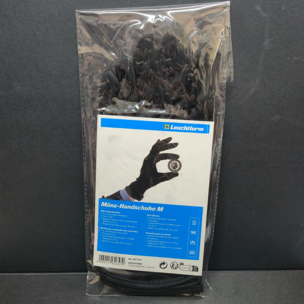 Packaged black gloves with a Leuchtther label on a dark background